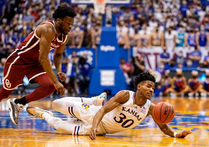 Kansas Jayhawks guard Ochai Agbaji (30) dives for a loose ball against Oklahoma Sooners guard Elijah Harkless (55) during the second half at Allen Fieldhouse.